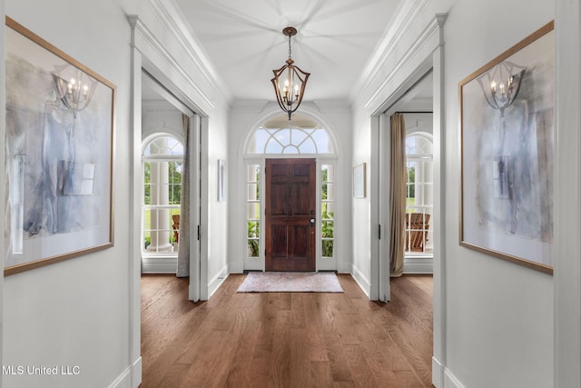1053 Woodbridge Dr, Brandon, MS 39047 - foyer featuring a chandelier, crown molding, baseboards, and wood finished floors