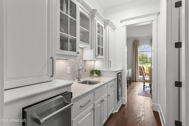 1053 Woodbridge Dr, Brandon, MS 39047 - kitchen with a sink, dark wood finished floors, light countertops, white cabinetry, and backsplash