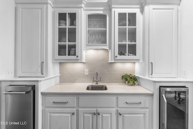 1053 Woodbridge Dr, Brandon, MS 39047 - bar with beverage cooler, a sink, and tasteful backsplash