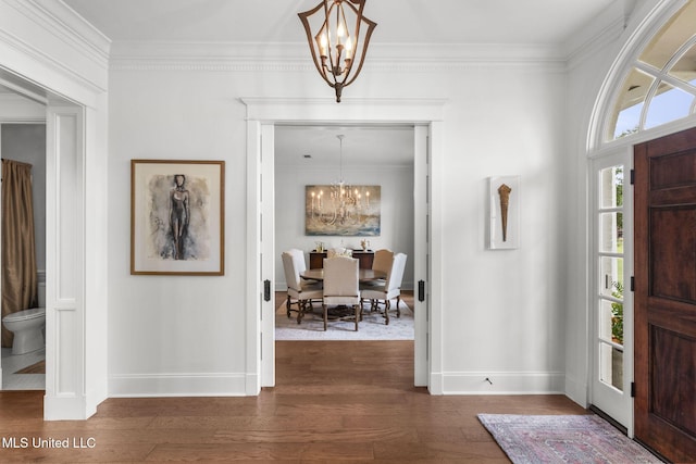 1053 Woodbridge Dr, Brandon, MS 39047 - foyer featuring a chandelier, baseboards, crown molding, and dark wood-type flooring