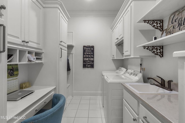 1053 Woodbridge Dr, Brandon, MS 39047 - laundry room featuring cabinet space, separate washer and dryer, light tile patterned floors, crown molding, and baseboards