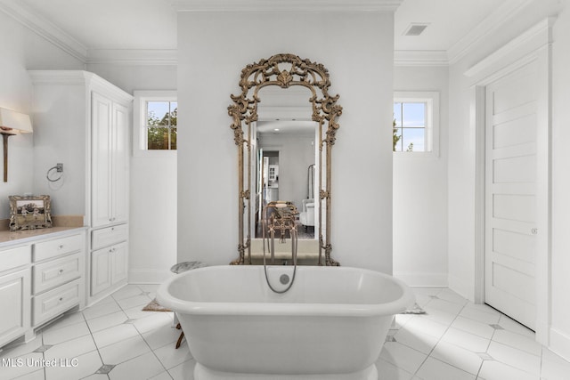 1053 Woodbridge Dr, Brandon, MS 39047 - bathroom with a soaking tub, plenty of natural light, crown molding, and tile patterned floors