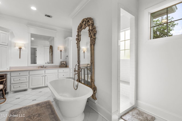 1053 Woodbridge Dr, Brandon, MS 39047 - full bath with a freestanding tub, vanity, crown molding, baseboards, and tile patterned flooring