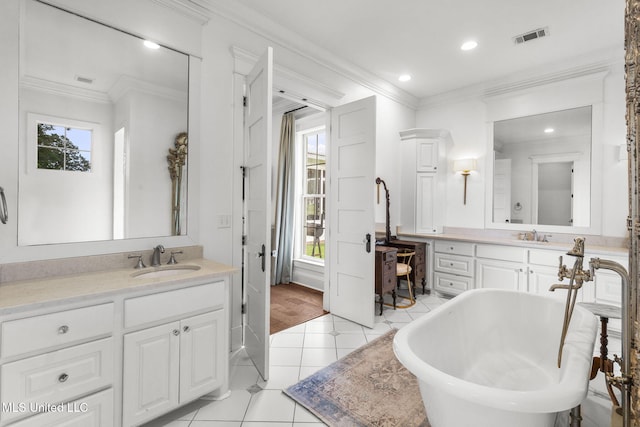 1053 Woodbridge Dr, Brandon, MS 39047 - bathroom with crown molding, a soaking tub, vanity, tile patterned flooring, and recessed lighting