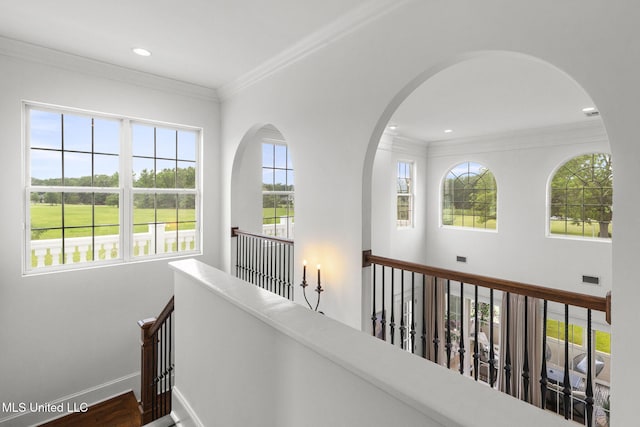 1053 Woodbridge Dr, Brandon, MS 39047 - corridor featuring an upstairs landing, ornamental molding, baseboards, recessed lighting, and arched walkways