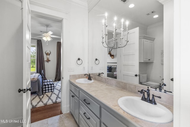 1053 Woodbridge Dr, Brandon, MS 39047 - bathroom featuring ensuite bath, ornamental molding, double vanity, toilet, and a ceiling fan