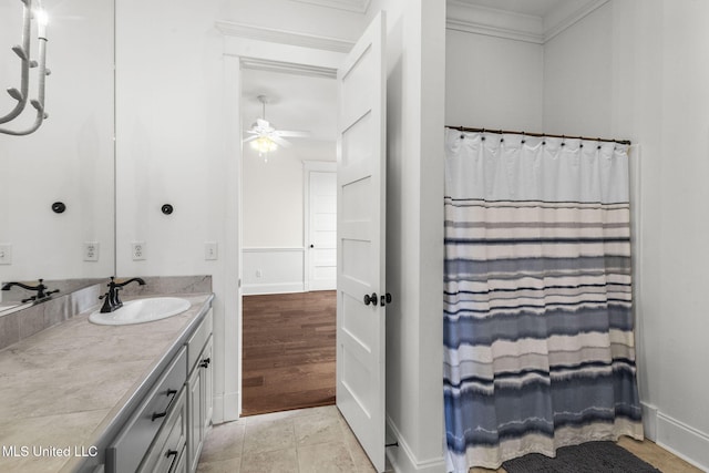 1053 Woodbridge Dr, Brandon, MS 39047 - bathroom with vanity, ornamental molding, ceiling fan, baseboards, and a shower with curtain