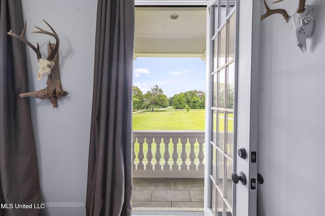 1053 Woodbridge Dr, Brandon, MS 39047 - doorway to outside featuring view of wooded area, tile patterned flooring, and golf course view