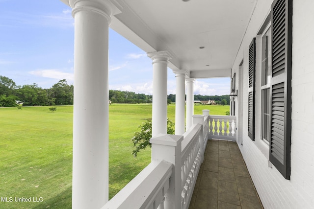 1053 Woodbridge Dr, Brandon, MS 39047 - covered porch featuring view of wooded area