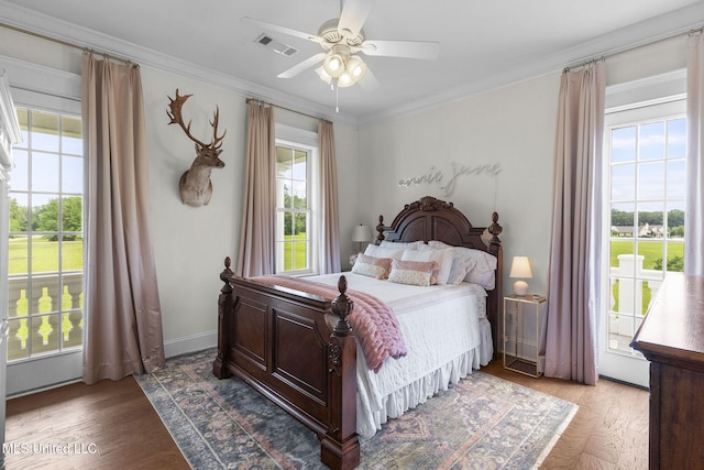 1053 Woodbridge Dr, Brandon, MS 39047 - bedroom featuring multiple windows, wood finished floors, crown molding, ceiling fan, and access to outside