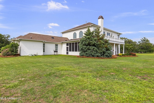 1053 Woodbridge Dr, Brandon, MS 39047 - rear view of property with a chimney, a yard, and a balcony