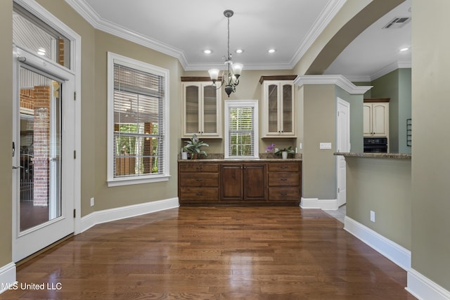 5578 E Diamondhead Dr, Diamondhead, MS 39525 - unfurnished dining area featuring a chandelier, dark wood-style floors, crown molding, baseboards, and recessed lighting