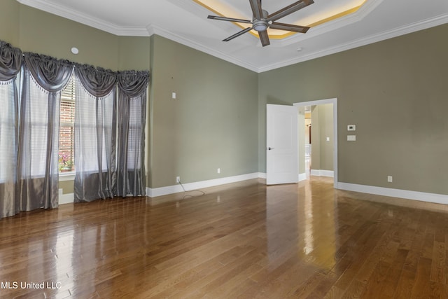 5578 E Diamondhead Dr, Diamondhead, MS 39525 - spare room with a ceiling fan, wood finished floors, crown molding, and baseboards
