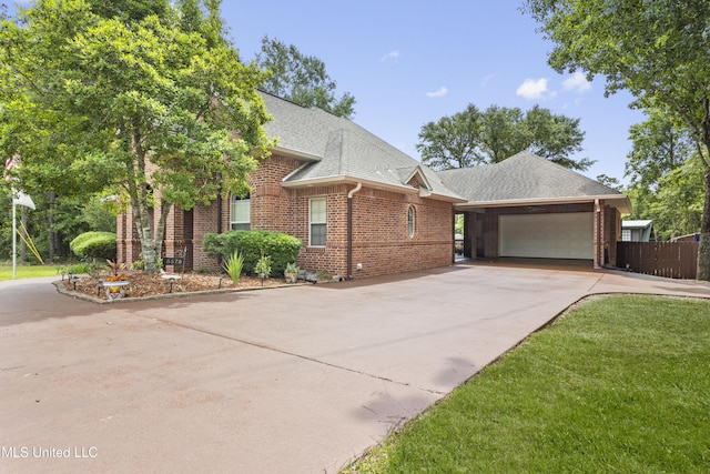 5578 E Diamondhead Dr, Diamondhead, MS 39525 - view of front of property with brick siding, an attached garage, concrete driveway, and a shingled roof