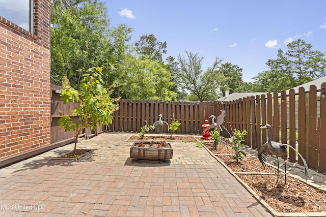 5578 E Diamondhead Dr, Diamondhead, MS 39525 - fenced backyard featuring a patio area