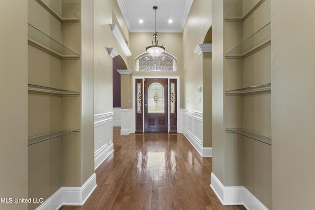 5578 E Diamondhead Dr, Diamondhead, MS 39525 - entrance foyer with wood-type flooring, ornamental molding, wainscoting, a towering ceiling, and recessed lighting