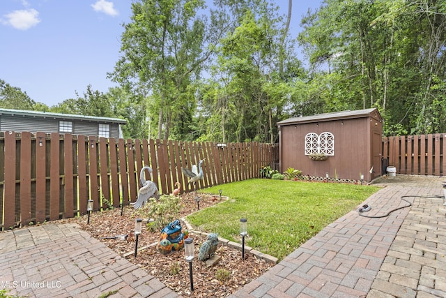 5578 E Diamondhead Dr, Diamondhead, MS 39525 - view of yard with a patio area and an outbuilding