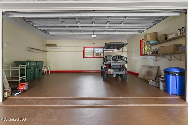 5578 E Diamondhead Dr, Diamondhead, MS 39525 - garage with baseboards