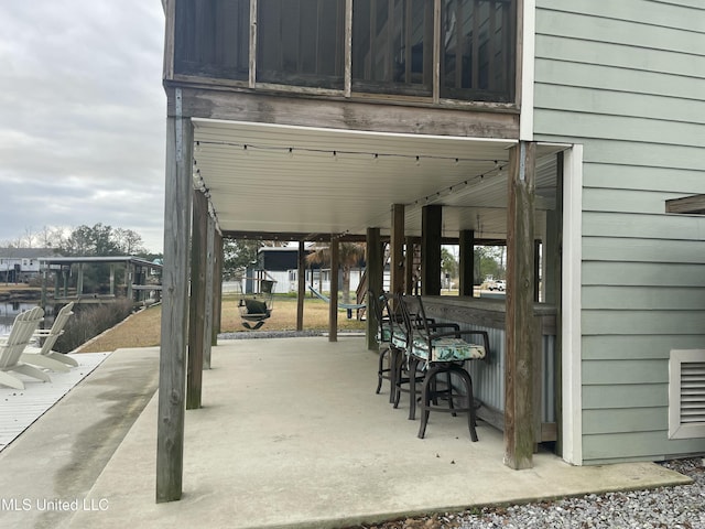 view of patio / terrace featuring outdoor dry bar