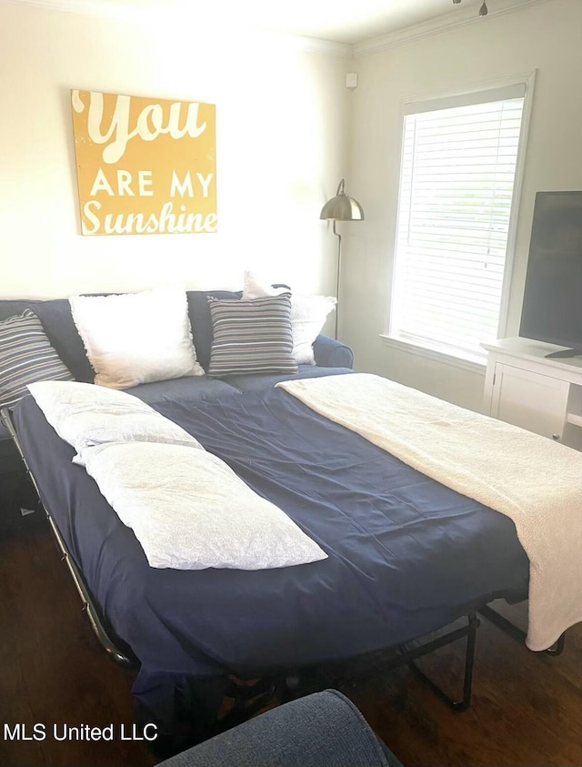 bedroom with crown molding