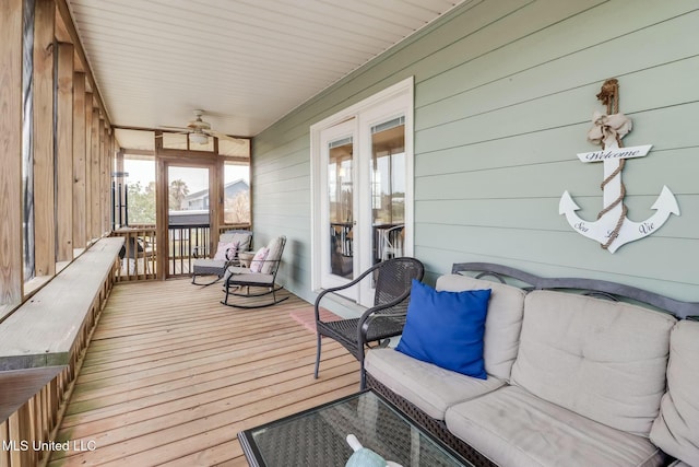 sunroom / solarium with ceiling fan