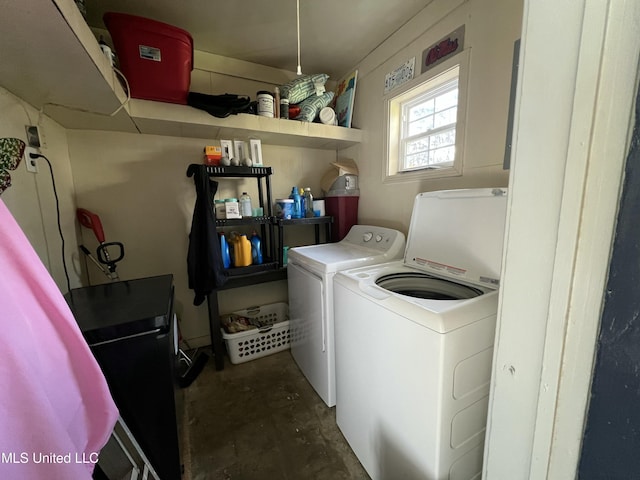 clothes washing area featuring laundry area and washing machine and dryer