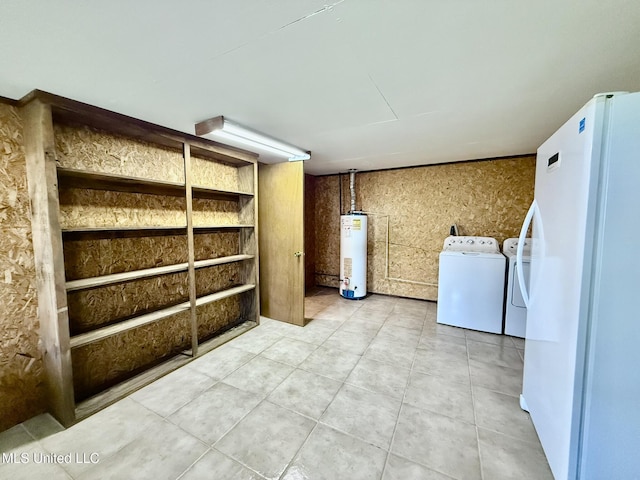 interior space with gas water heater and washer and clothes dryer