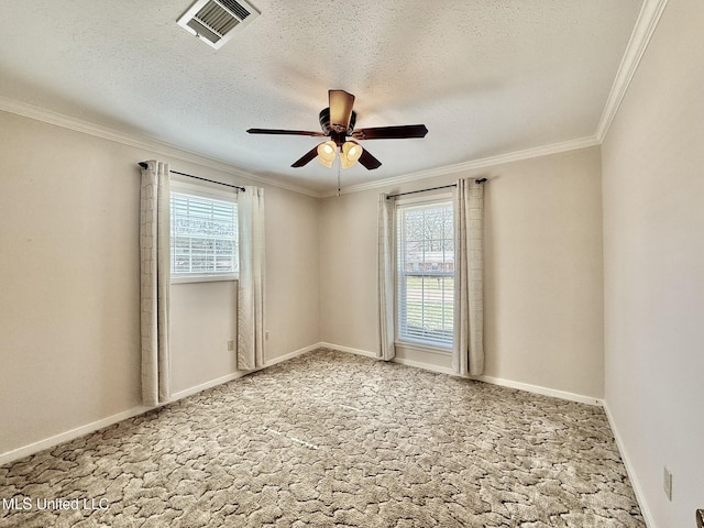 unfurnished room featuring visible vents, crown molding, ceiling fan, light colored carpet, and a textured ceiling