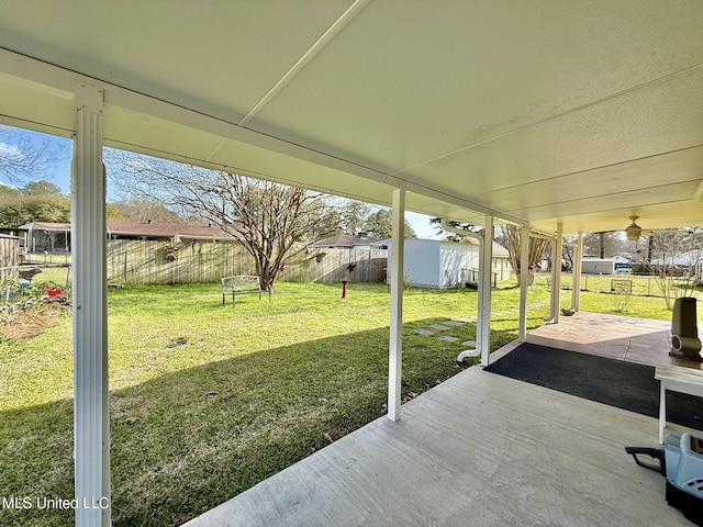 view of patio featuring an outbuilding and a fenced backyard