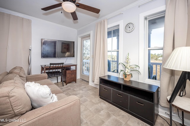 living room featuring ceiling fan and ornamental molding