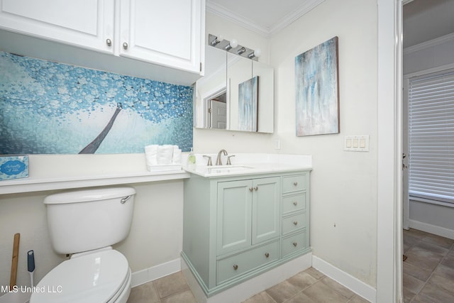 bathroom with toilet, vanity, ornamental molding, and tile patterned flooring