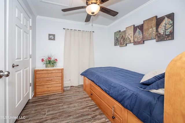 bedroom with ceiling fan, dark hardwood / wood-style flooring, and ornamental molding