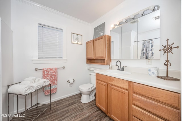 bathroom featuring toilet, hardwood / wood-style flooring, crown molding, a shower with curtain, and vanity