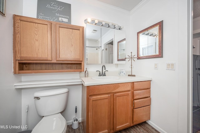 bathroom with wood-type flooring, vanity, a shower, toilet, and crown molding