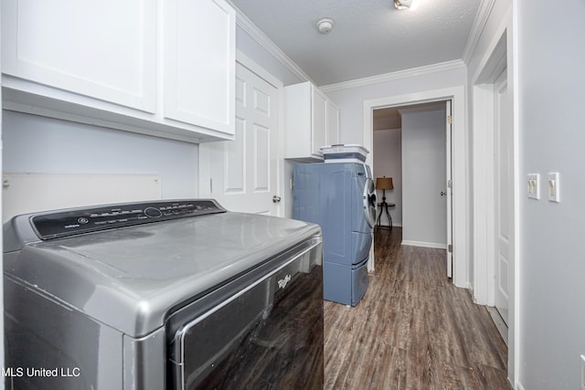 laundry area with a textured ceiling, cabinets, crown molding, and wood-type flooring