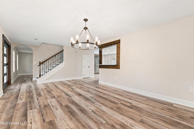 interior space featuring a chandelier and light hardwood / wood-style floors