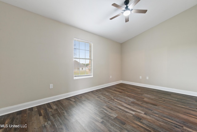 empty room featuring ceiling fan and dark wood-type flooring