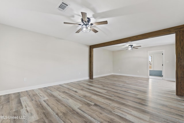 unfurnished room with ceiling fan and light hardwood / wood-style flooring