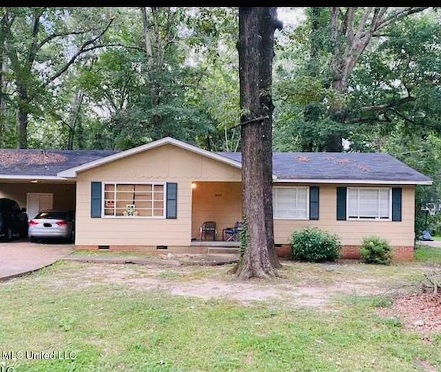 3650 Meadow Ln, Jackson, MS 39212 - ranch-style home with crawl space, a carport, a front yard, and driveway