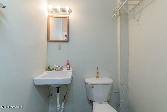 16063 W Daytona Dr, Pearlington, MS 39572 - half bathroom with a sink and toilet