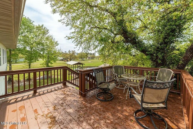 16063 W Daytona Dr, Pearlington, MS 39572 - wooden terrace featuring a lawn