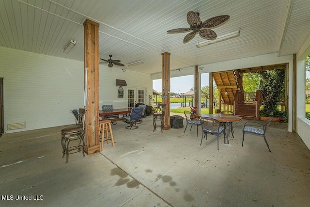 16063 W Daytona Dr, Pearlington, MS 39572 - view of patio / terrace with outdoor dining space and ceiling fan