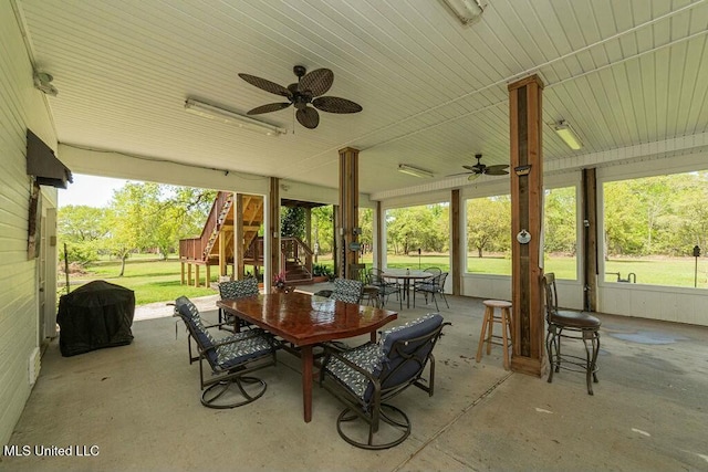 16063 W Daytona Dr, Pearlington, MS 39572 - view of patio with ceiling fan, grilling area, stairs, and outdoor dining space
