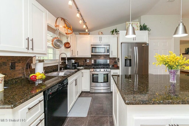 16063 W Daytona Dr, Pearlington, MS 39572 - kitchen featuring vaulted ceiling, stainless steel appliances, decorative backsplash, a sink, and white cabinets