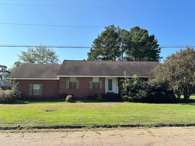 ranch-style house with a front lawn