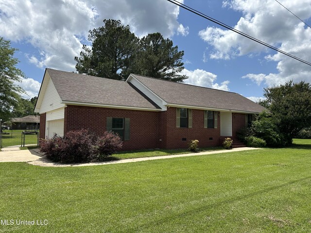 view of front of property with brick siding, a front lawn, and entry steps