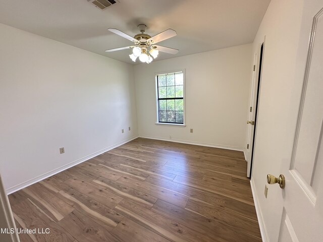 entryway with ornamental molding, carpet floors, a ceiling fan, and baseboards
