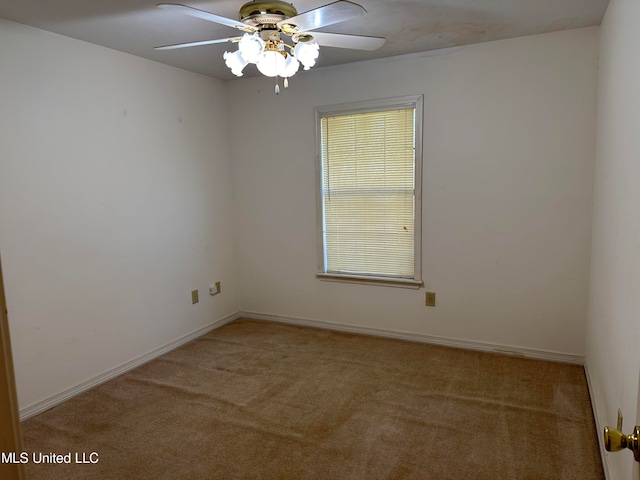 carpeted empty room with ceiling fan