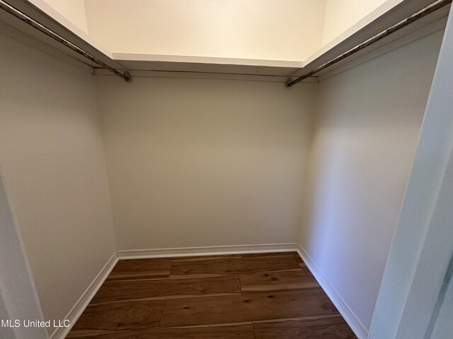carpeted spare room with ceiling fan and baseboards