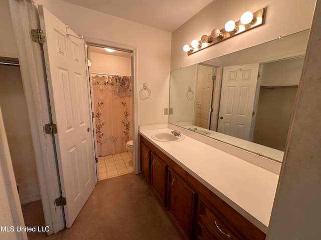 bathroom with vanity, a shower with curtain, and toilet